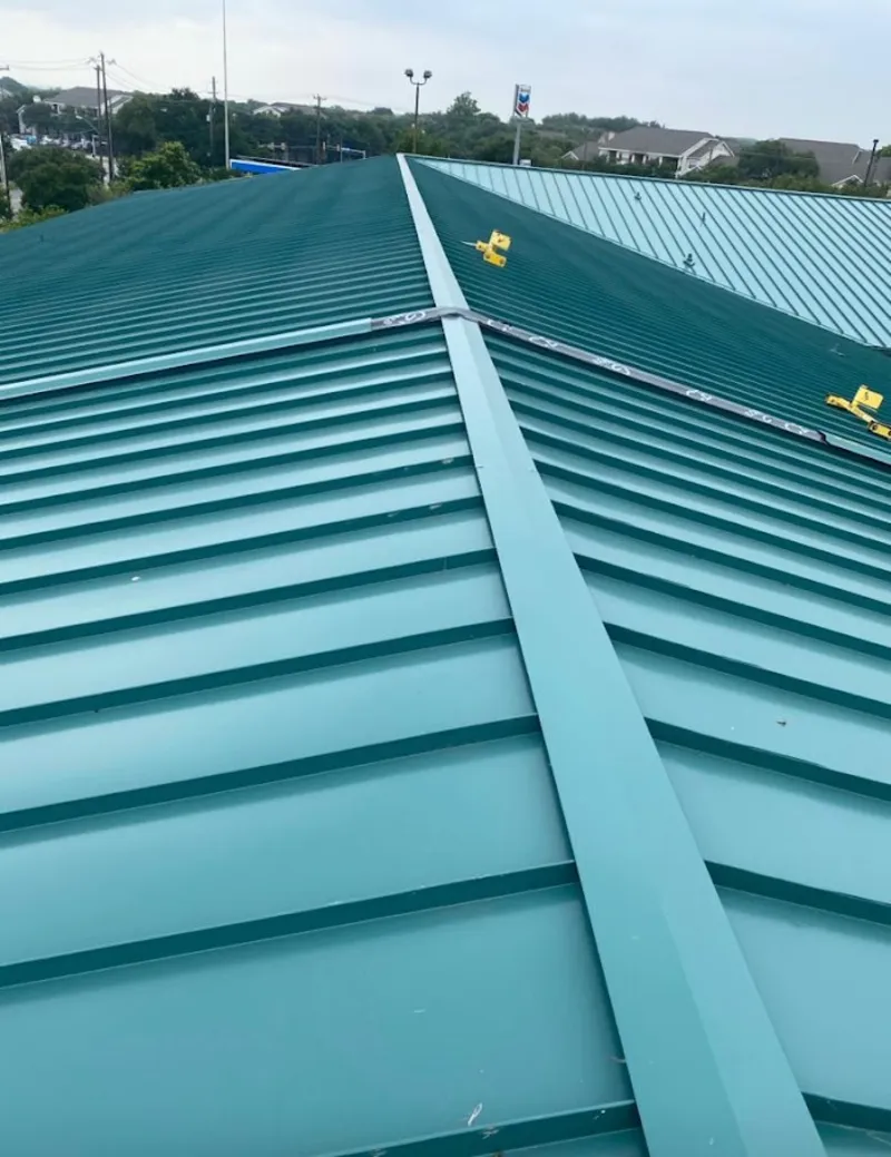 Green commercial metal roof ridge and valley for Metal Roof Repair in Genoa